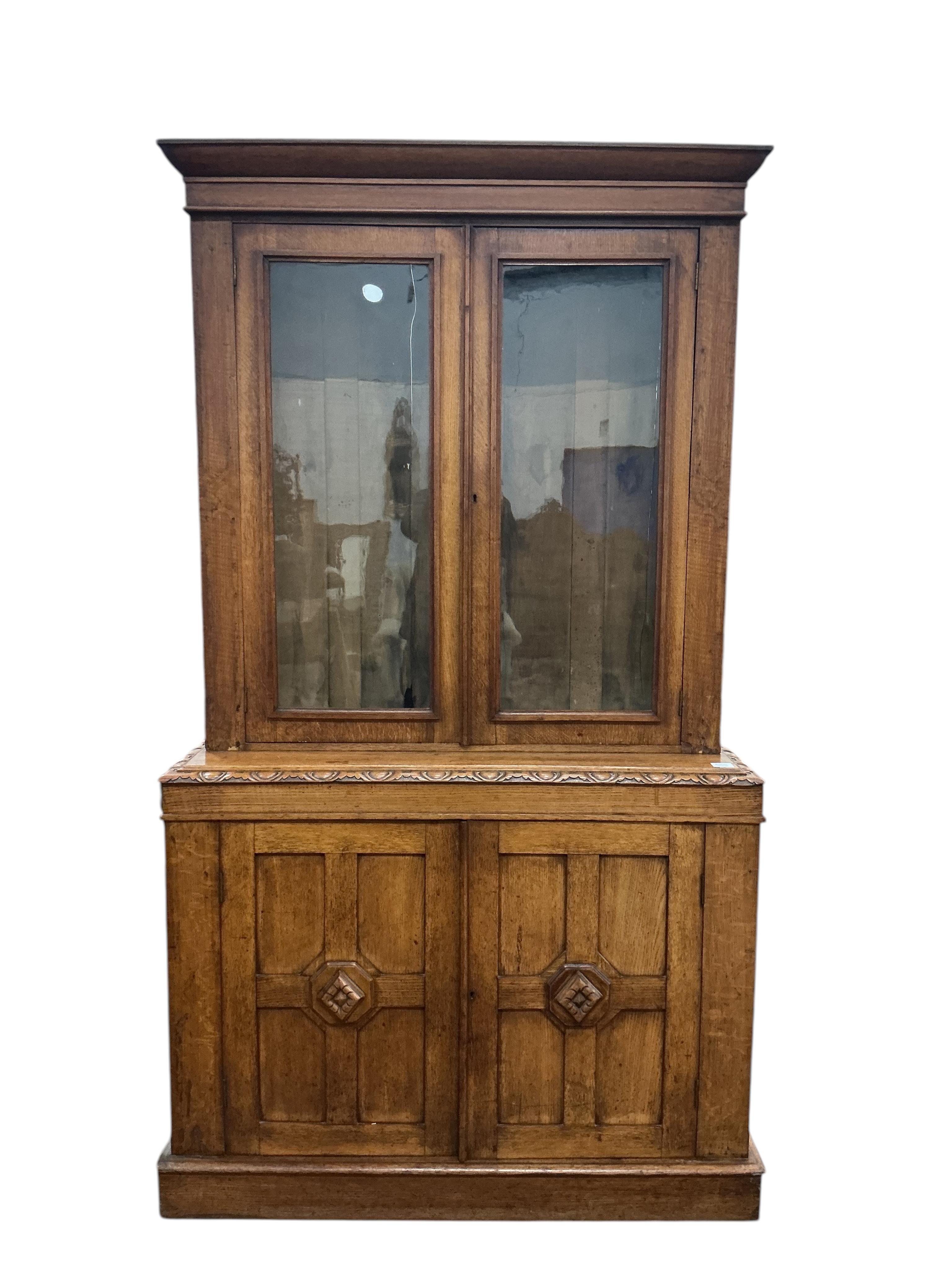 A late Victorian oak library bookcase, width 118cm, depth 40cm, height 210cm